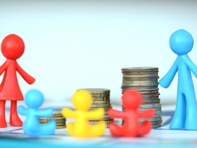 Model of family with stack of coins