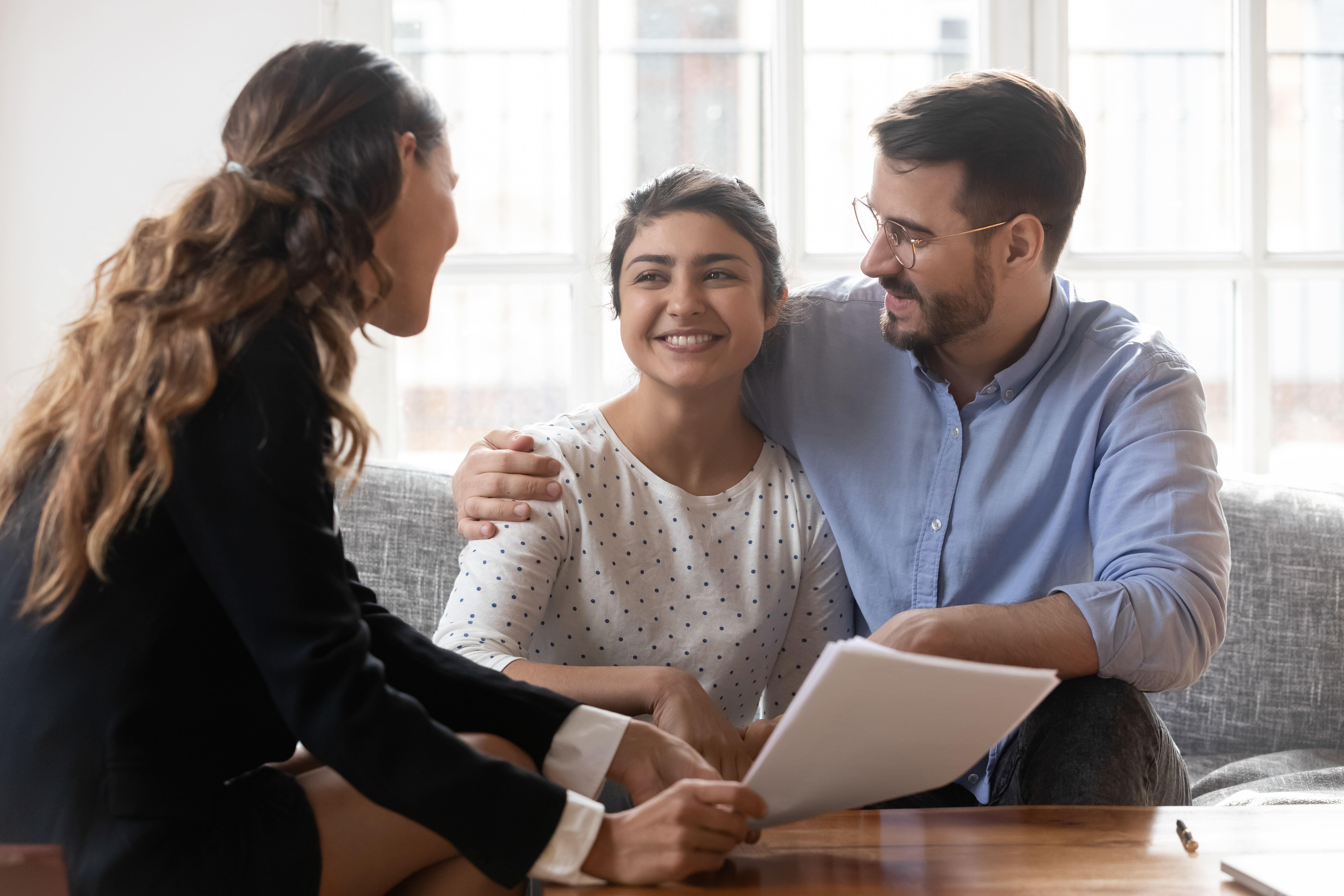 Couple with property manager and documents