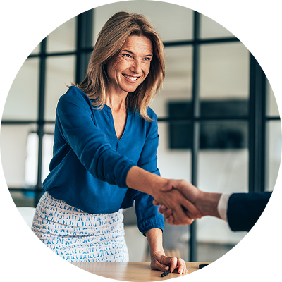 Business woman stands and shakes her colleague’s hand