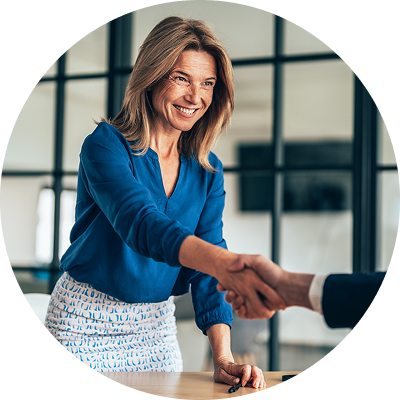 Business woman stands and shakes her colleague’s hand